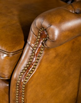 modern rustic tan leather recliner with button tufted back and arms