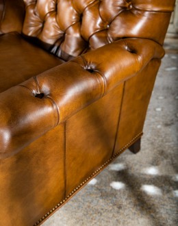 modern rustic tan leather recliner with button tufted back and arms