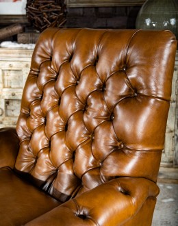 modern rustic tan leather recliner with button tufted back and arms