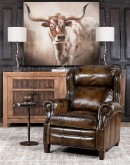 A luxurious Bronco Beretta Leather Recliner in rich brown top grain leather, featuring hand-burnished details, brass nail tacks, leather welting, and a bustleback design for optimal head and neck support.