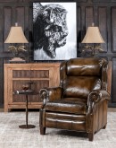 A luxurious Bronco Beretta Leather Recliner in rich brown top grain leather, featuring hand-burnished details, brass nail tacks, leather welting, and a bustleback design for optimal head and neck support.