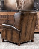 A luxurious Bronco Beretta Leather Recliner in rich brown top grain leather, featuring hand-burnished details, brass nail tacks, leather welting, and a bustleback design for optimal head and neck support.