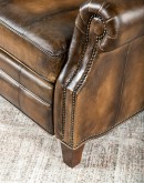 A luxurious Bronco Beretta Leather Recliner in rich brown top grain leather, featuring hand-burnished details, brass nail tacks, leather welting, and a bustleback design for optimal head and neck support.