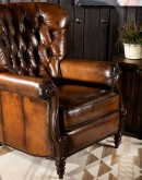 dark saddle leather recliner with tufted back