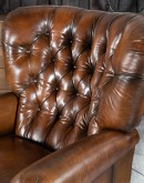 dark saddle leather recliner with tufted back