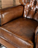 dark saddle leather recliner with tufted back