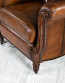 dark saddle leather recliner with tufted back