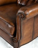 dark saddle leather recliner with tufted back