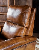 Image of Revolver Bourbon Leather Recliner featuring sleek, tapered arms, bustle back, and full-grain leather with hand-burnished details, showcasing its luxurious, modern rustic design