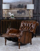 distressed leather recliner with button tufting on seat and back