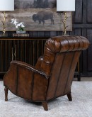 distressed leather recliner with button tufting on seat and back