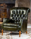 distressed olive green leather recliner with button tufting on seat and back