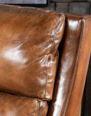 Brown Leather Recliner with full-grain leather, hand-burnished details, brass nail tacks, and bustle back design for optimal comfort.