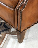 Brown Leather Recliner with full-grain leather, hand-burnished details, brass nail tacks, and bustle back design for optimal comfort.