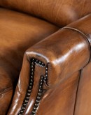 Brown Leather Recliner with full-grain leather, hand-burnished details, brass nail tacks, and bustle back design for optimal comfort.