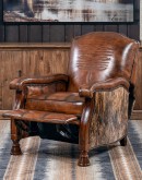 A brown leather recliner chair with a wooden base and armrests is pictured against a plain beige background. The chair has a tight back with a boot stitch emblem and is adorned with premium upholstery grade brindle cowhide on the sides and outside back. T