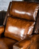 light brown leather recliner with bustle back