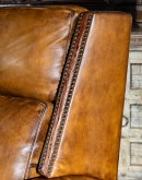 tan saddle leather recliner with bustle back