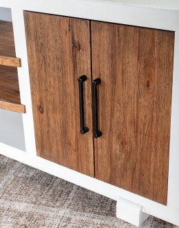 A TX Blanco Media Console with a two-tone finish, combining Avalanche White and Vintage Natural over rustic Hickory wood. Features include four doors with dark brushed bronze bar pulls, adjustable shelves, and a ventilated back panel.