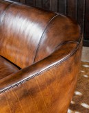 Image of Benson Leather Sofa, small-scale, modern rustic design with full-grain leather, hand-burnished details, rolled legs at the back and arch-styled front, showcasing 8-way hand-tied construction