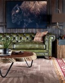 American-made Berkshire Olive Chesterfield Sofa with hand burnished full-grain leather and brass nail tacks detailing, showcasing traditional craftsmanship.