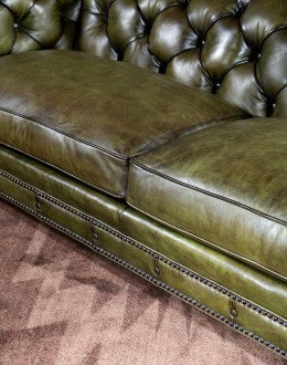 American-made Berkshire Olive Chesterfield Sofa with hand burnished full-grain leather and brass nail tacks detailing, showcasing traditional craftsmanship.