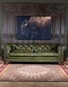 American-made Berkshire Olive Chesterfield Sofa with hand burnished full-grain leather and brass nail tacks detailing, showcasing traditional craftsmanship.