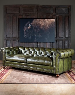 American-made Berkshire Olive Chesterfield Sofa with hand burnished full-grain leather and brass nail tacks detailing, showcasing traditional craftsmanship.