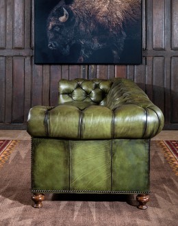 American-made Berkshire Olive Chesterfield Sofa with hand burnished full-grain leather and brass nail tacks detailing, showcasing traditional craftsmanship.