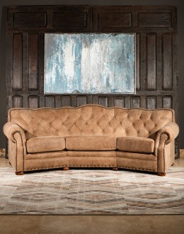 curved leather sofa with tufted seat back in tan distressed leather