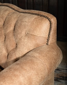 curved leather sofa with tufted seat back in tan distressed leather