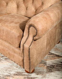 curved leather sofa with tufted seat back in tan distressed leather