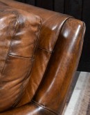 The Cowboy AF Leather Sofa is a western-style armchair with a luxurious full-grain leather finish