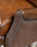 The Cowboy AF Leather Sofa is a western-style armchair with a luxurious full-grain leather finish