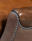 The Cowboy AF Leather Sofa is a western-style armchair with a luxurious full-grain leather finish