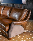The Cowboy AF Leather Sofa is a western-style armchair with a luxurious full-grain leather finish