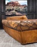 Mountain Mesa Leather Sofa featuring hand-painted mountain landscape, full-grain leather upholstery, and stitched front arm panels, part of Adobe Interiors' Mountain Ranch Collection.