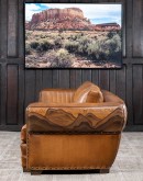 Mountain Mesa Leather Sofa featuring hand-painted mountain landscape, full-grain leather upholstery, and stitched front arm panels, part of Adobe Interiors' Mountain Ranch Collection.