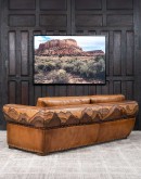 Mountain Mesa Leather Sofa featuring hand-painted mountain landscape, full-grain leather upholstery, and stitched front arm panels, part of Adobe Interiors' Mountain Ranch Collection.