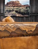 Mountain Mesa Leather Sofa featuring hand-painted mountain landscape, full-grain leather upholstery, and stitched front arm panels, part of Adobe Interiors' Mountain Ranch Collection.