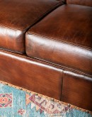 Luxurious Argonaut Leather Sofa with full-grain and Nubuck leather, brass nail tacks, and traditional craftsmanship details, seating four comfortably