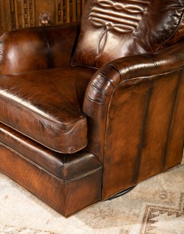 leather chair with a boot stitch design on seat back