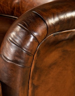 leather chair with a boot stitch design on seat back