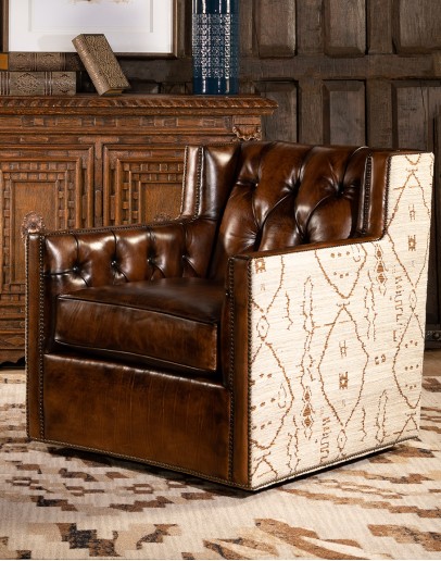 swivel chair with dark tufted leather on inside and southwestern style fabric on outside