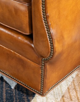 Durango Swivel Glider swivel glider chair with light brown saddle leather,