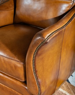 Durango Swivel Glider swivel glider chair with light brown saddle leather,