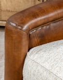 Ella Bark Swivel Chair featuring a blend of hand-burnished leather and light tweed fabric upholstery, showcasing a sleek design with a hardwood frame and swivel mechanism.