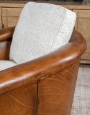 Ella Bark Swivel Chair featuring a blend of hand-burnished leather and light tweed fabric upholstery, showcasing a sleek design with a hardwood frame and swivel mechanism.