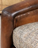 Ella Cocoa Swivel Chair featuring a blend of hand-burnished leather and tweed fabric upholstery, showcasing a sleek design with a hardwood frame and swivel mechanism.