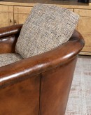 Ella Cocoa Swivel Chair featuring a blend of hand-burnished leather and tweed fabric upholstery, showcasing a sleek design with a hardwood frame and swivel mechanism.